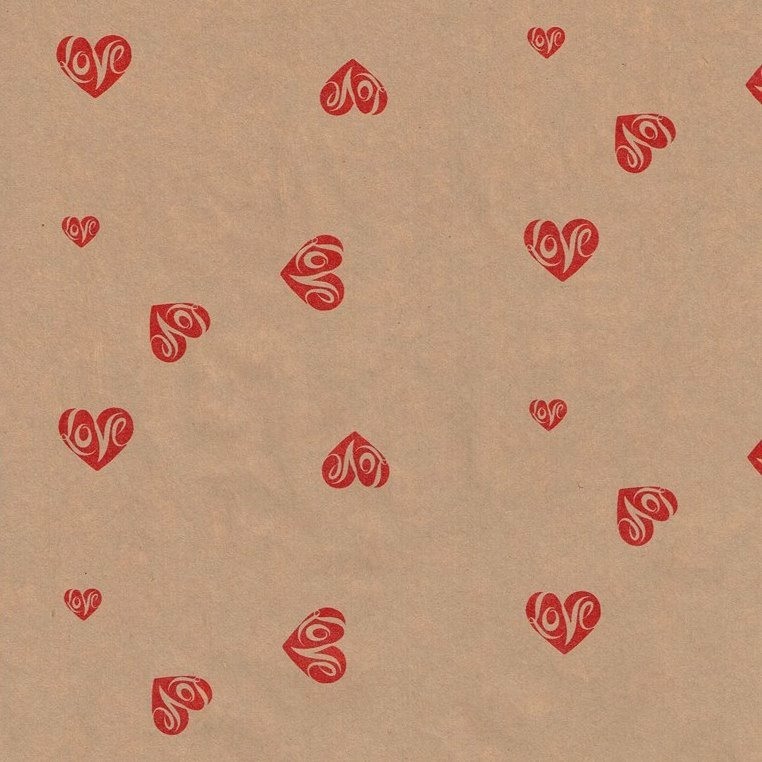 Wrapping paper with hearts and love text on strong natural eco paper.
 