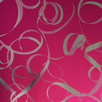 Gift wrapping paper pink with a silver ribbon on metallic paper.
 
